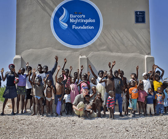 Haitian families infront of BNF water well